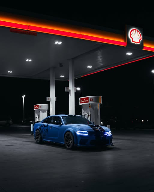 Blue Dodge Charger with window tint at night