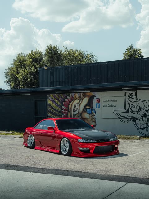 Red Nissan Silvia with custom vinyl work